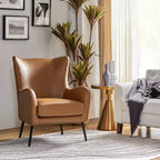 Fauteuil classique avec dossier à oreilles et clous décoratifs