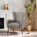 Fauteuil classique avec dossier à oreilles et clous décoratifs