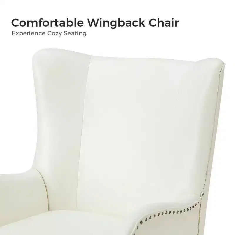 Fauteuil classique avec dossier à oreilles et clous décoratifs