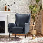 Fauteuil classique avec dossier à oreilles et clous décoratifs