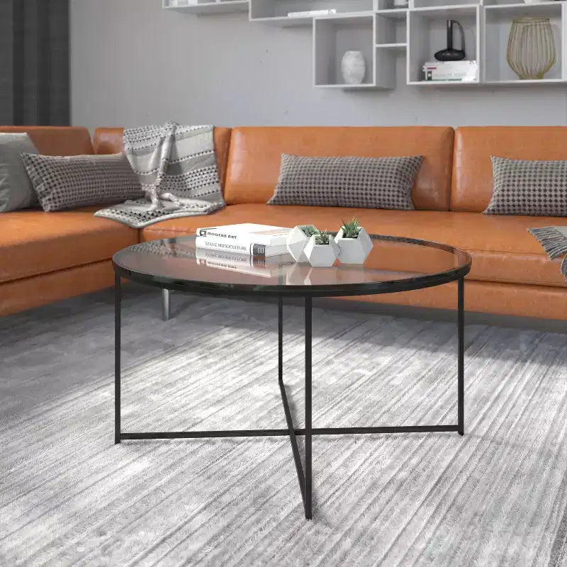 Table basse de salon en verre avec piètement en métal entrecroisé